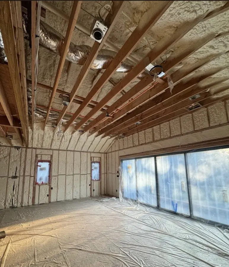 Interior walls and ceiling insulated with spray foam during new construction in Upper Grand Lagoon